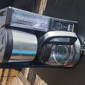 Stainless steel and black Ninja coffee maker